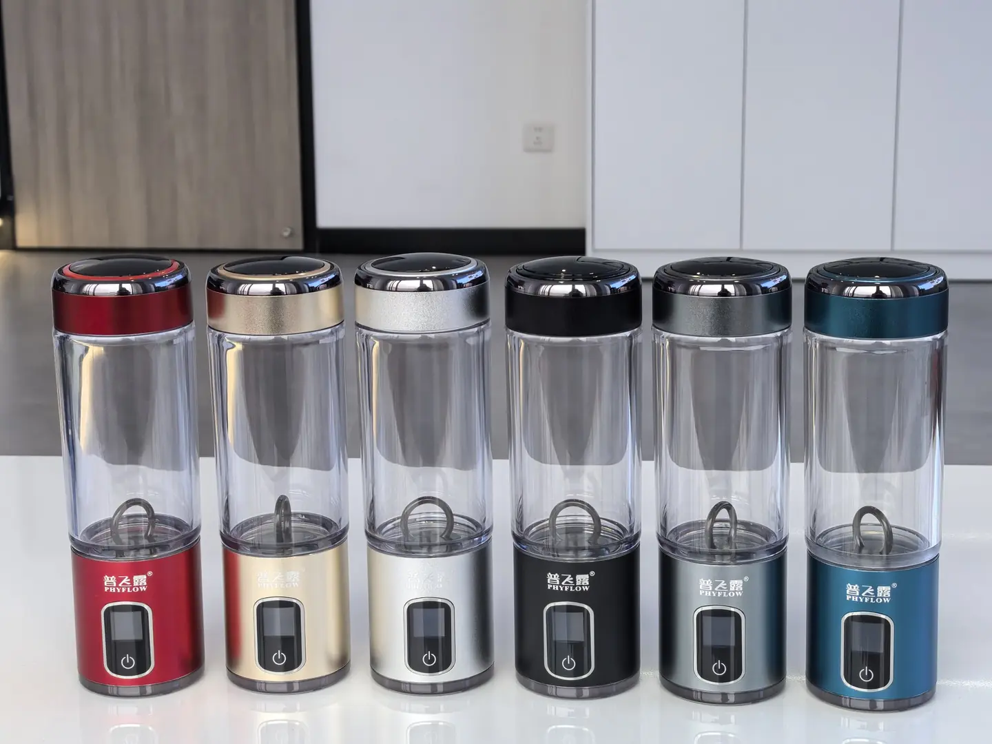 Six PHYFLOW H88 hydrogen water bottles in red, champagne, silver, black, gray, and blue