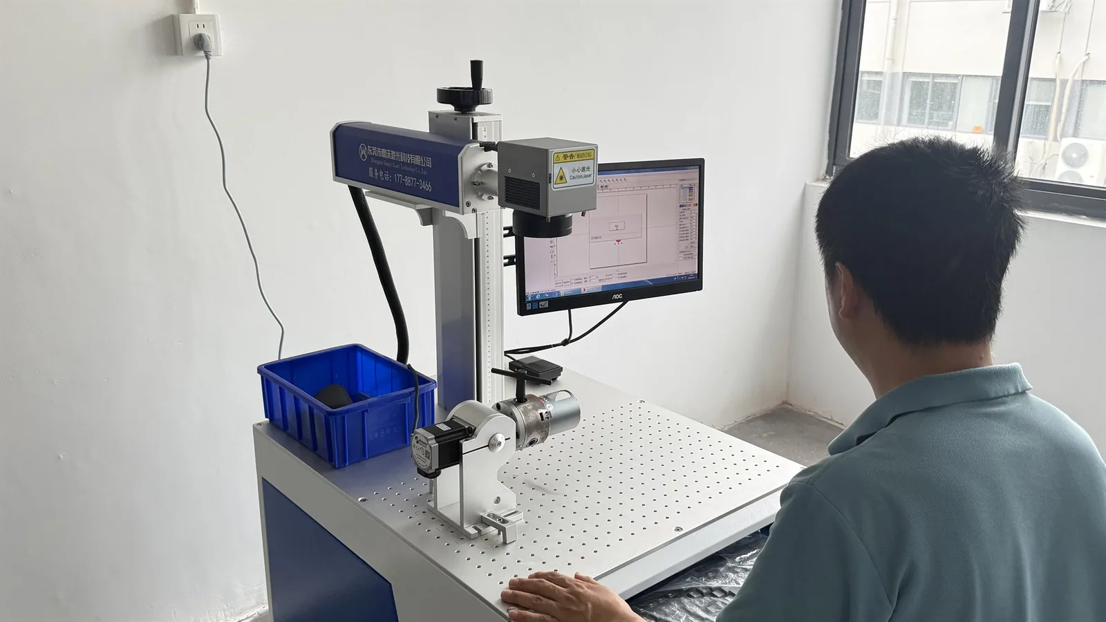 Operators using laser equipment to mark hydrogen water bottle logos