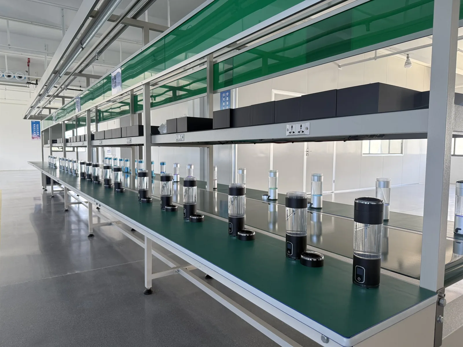 Hydrogen water bottles arranged on a clean OEM production line