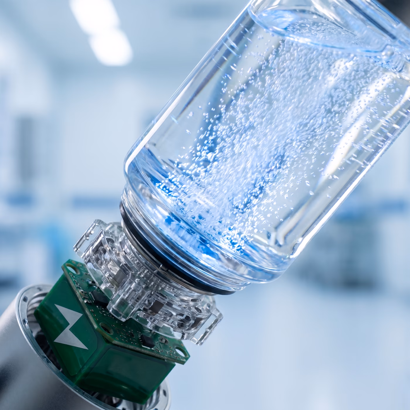 Close-up of bubbles forming inside a hydrogen water bottle during electrolysis